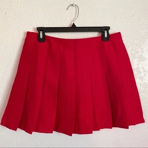red mini pleated skirt